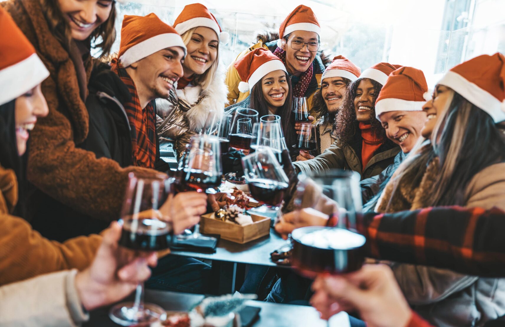 happy-people-wearing-santa-claus-hat-having-christ-2023-11-27-05-35-45-utc-min-aspect-ratio-1712-1108